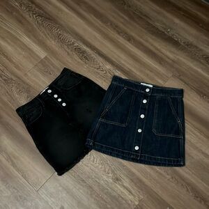 One black and one navy blue denim skirts/shorts